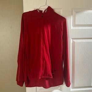 Nike running jacket, has hoodie and thumb holes. Never worn